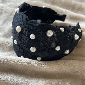 Hand made (by me) black headband with white Pearl details.